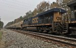 CSX 5465 waits for green with a line of covered hoppers